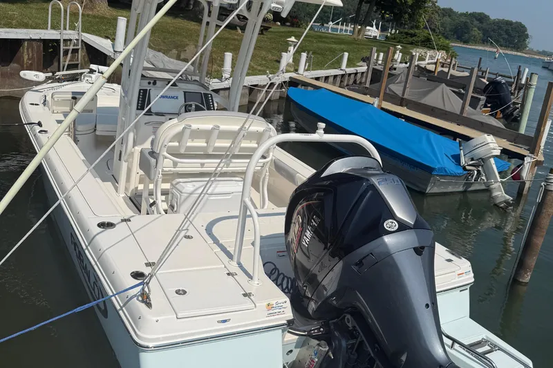 Slide: The Image of 2022 Robalo 226 Cayman boat docked with Yamaha outboard motor. - 5