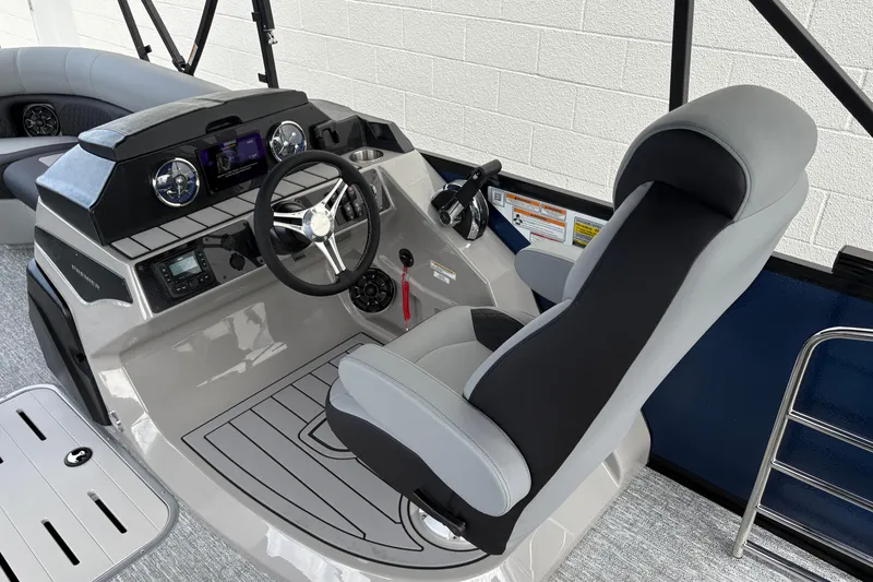 Slide: The Image of 2026 Premier 230 Sunsation RL boat helm with modern controls and comfortable seating. - 10