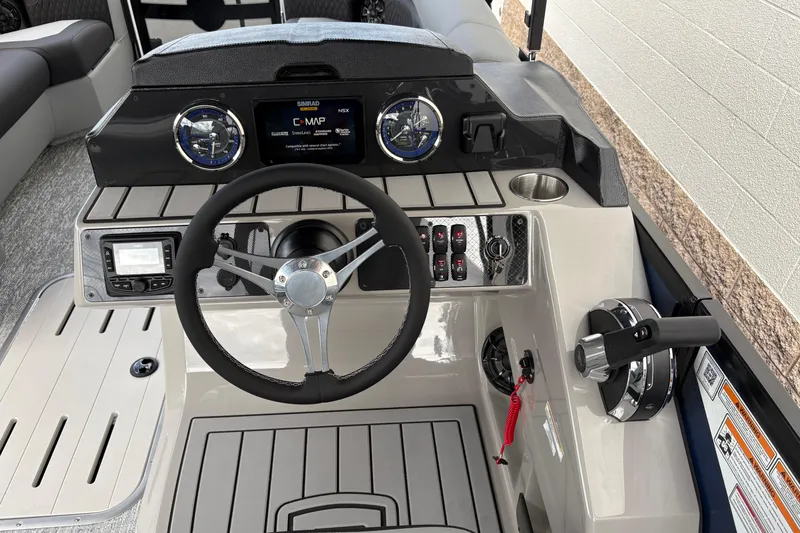 Slide: The Image of Steering console of 2026 Premier 230 Sunsation RL boat with modern controls and dashboard. - 11