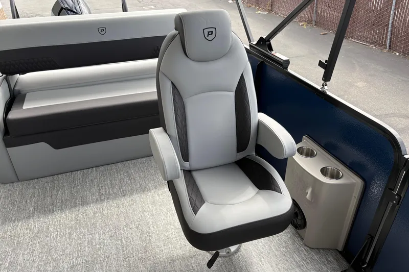 Slide: The Image of Luxury seating on 2026 Premier 230 Sunsation RL boat with cup holders. - 13