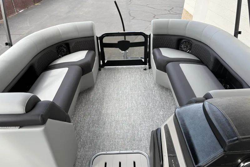Slide: The Image of Luxurious interior of 2026 Premier 230 Sunsation RL pontoon boat with plush seating. - 14