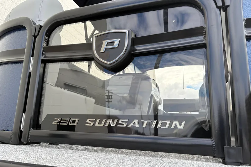 Slide: The Image of 2026 Premier 230 Sunsation RL pontoon boat with sleek design and logo detail. - 18