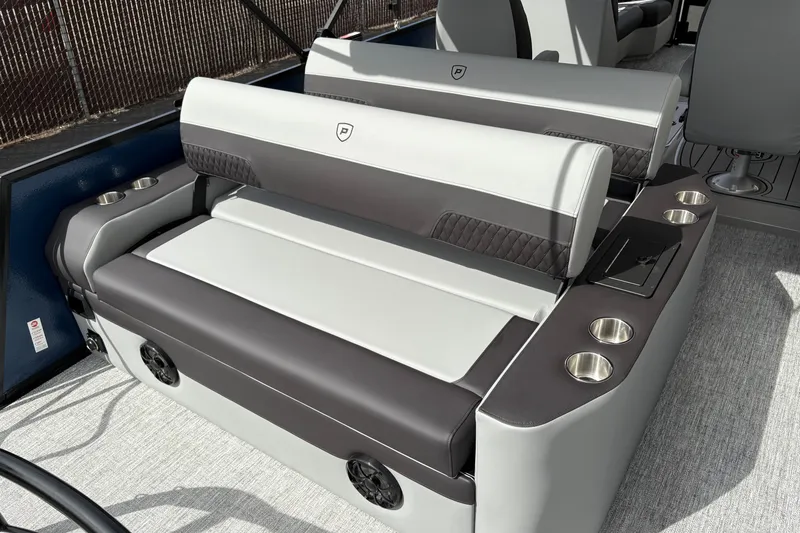 Slide: The Image of Luxurious seating on 2026 Premier 230 Sunsation RL boat with cup holders and sleek design. - 7
