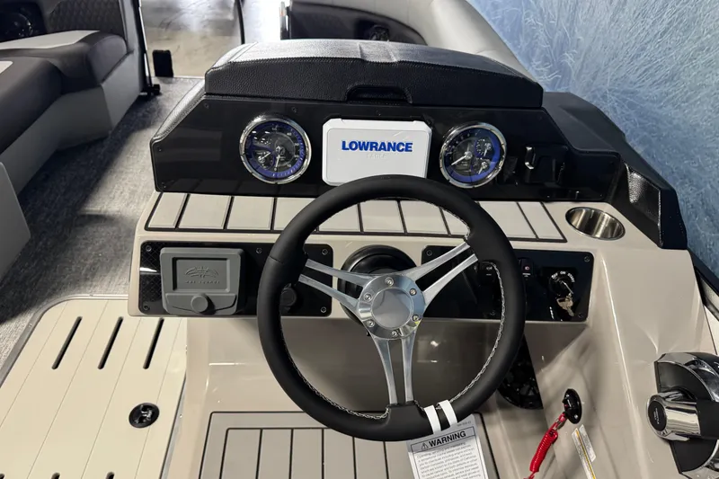 Slide: The Image of Steering console of 2026 Premier 210 Sunsation RL with Lowrance electronics and modern controls. - 11