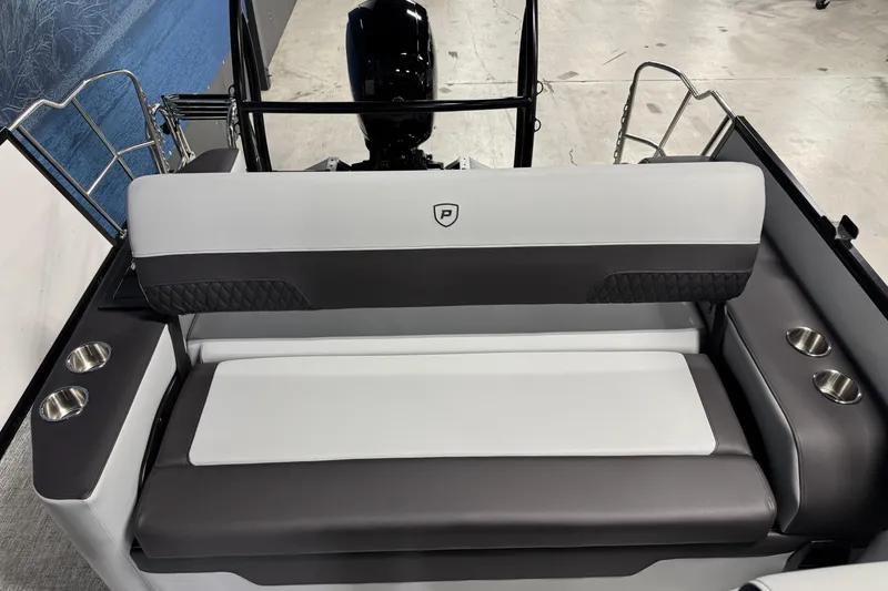 Slide: The Image of 2026 Premier 210 Sunsation RL boat interior with cushioned seating and cup holders. - 12