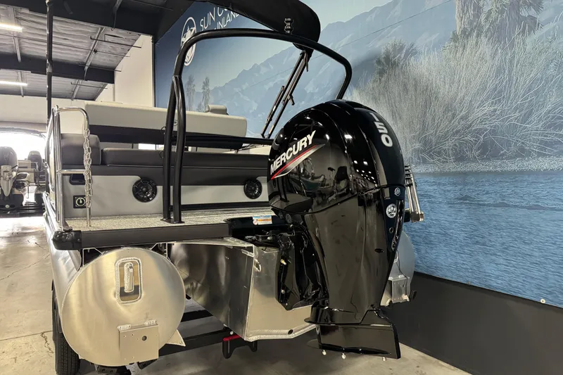 Slide: The Image of 2026 Premier 210 Sunsation RL pontoon boat with Mercury 50 outboard motor in showroom. - 5