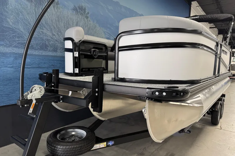 Slide: The Image of 2026 Premier 210 Sunsation RL pontoon boat on trailer in showroom. - 6