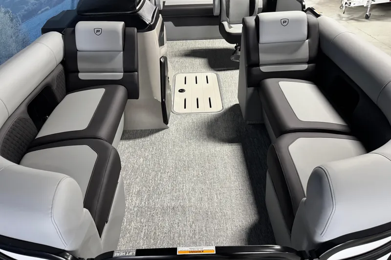 Slide: The Image of Interior of 2026 Premier 210 Sunsation RL pontoon boat with gray seating and carpet. - 7