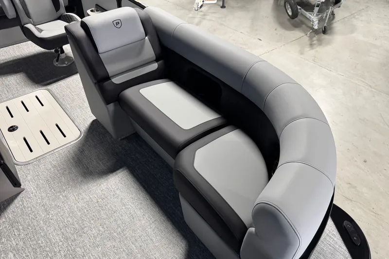 Slide: The Image of 2026 Premier 210 Sunsation RL boat interior with gray and black seating. - 8