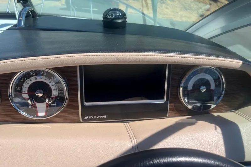 Slide: The Image of Dashboard of 2020 Four Winns V255 boat with speedometer and compass. - 17