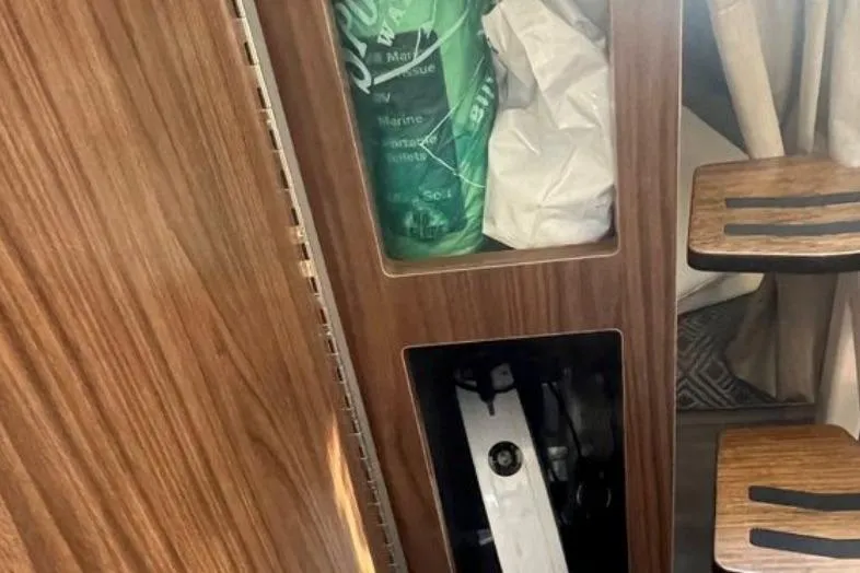 Slide: The Image of Interior storage compartments of a 2020 Four Winns V255 boat. - 21