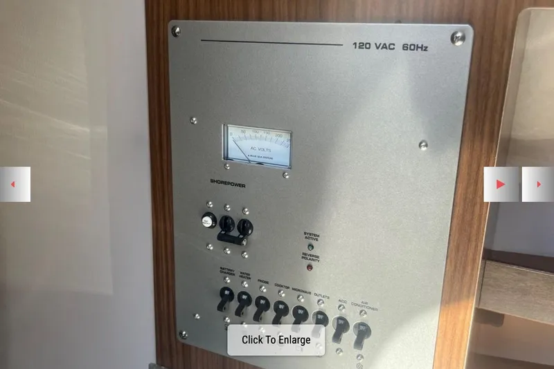 Slide: The Image of Electrical panel of 2020 Four Winns V255 boat, showing voltage meter and switches. - 29