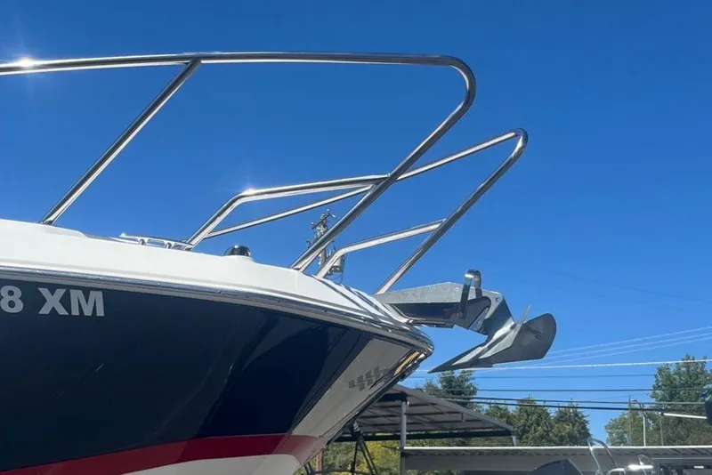 Slide: The Image of 2020 Four Winns V255 boat bow with anchor against clear blue sky. - 34
