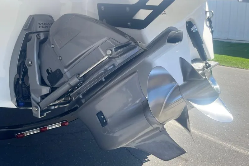 Slide: The Image of Close-up of a 2020 Four Winns V255 boat propeller and outdrive system. - 4