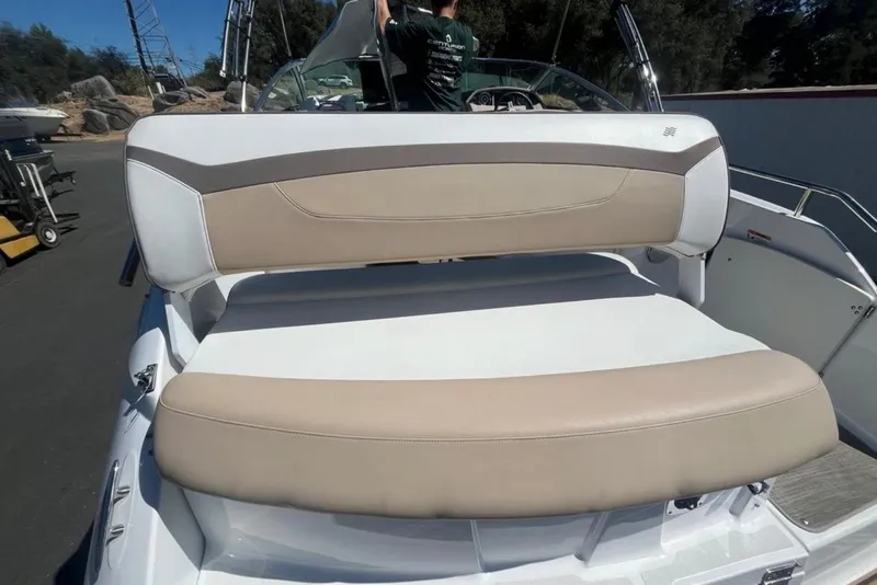 Slide: The Image of 2020 Four Winns V255 boat with beige and white seating on deck. - 5