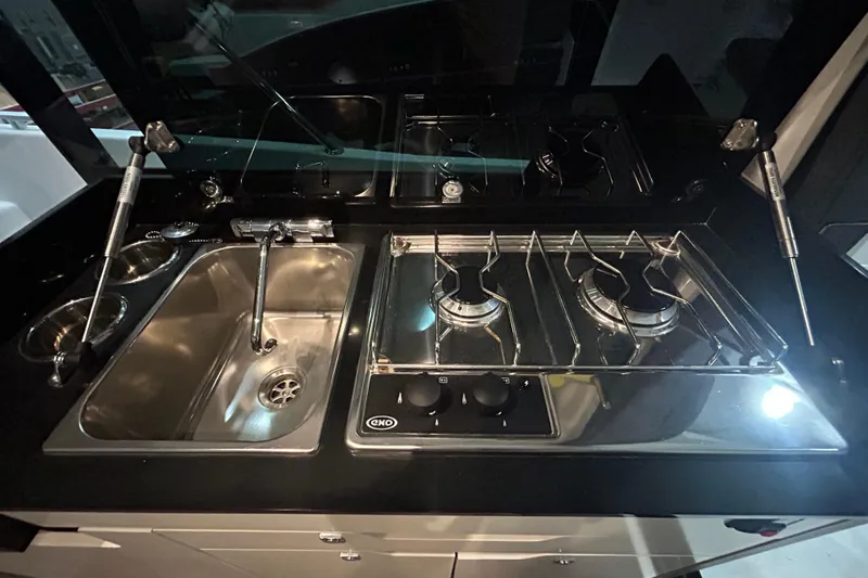 Slide: The Image of Interior of 2020 Beneteau Antares boat with seating and table arrangement. - 12