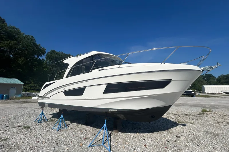 Slide: The Image of 2020 Beneteau Antares 9 boat deck with seating and sliding glass door. - 2