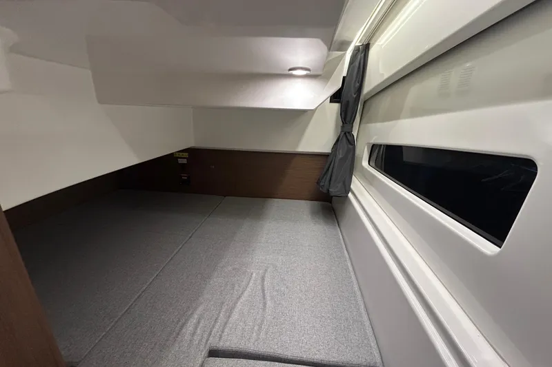 Slide: The Image of 2020 Beneteau Antares 9 boat deck with sliding glass doors and outdoor seating. - 4