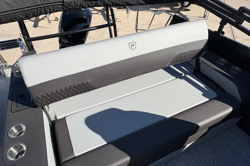 Slide: The Image of 2026 Premier 210 Sunsation RL boat seating with cup holders and stylish upholstery. - 12