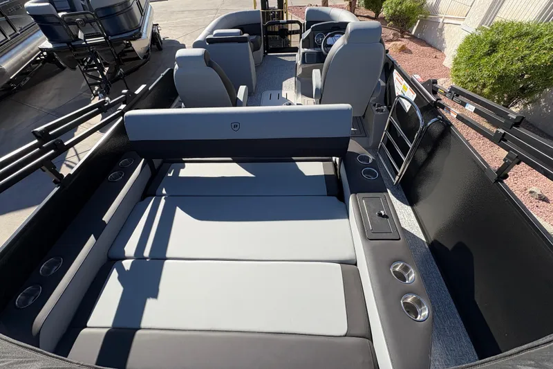 Slide: The Image of 2026 Premier 210 Sunsation RL pontoon boat interior with seating and cup holders. - 14