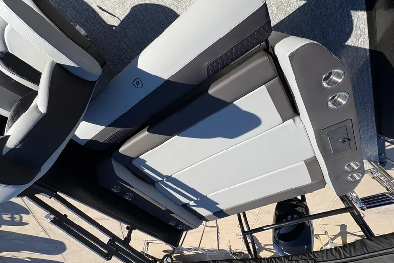 Slide: The Image of 2026 Premier 210 Sunsation RL boat interior with sleek seating and cup holders. - 15