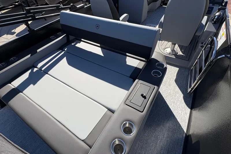 Slide: The Image of 2026 Premier 210 Sunsation RL boat interior with gray seating and cup holders. - 16