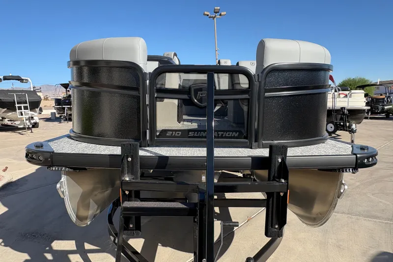 Slide: The Image of 2026 Premier 210 Sunsation RL pontoon boat on trailer, outdoor display. - 3