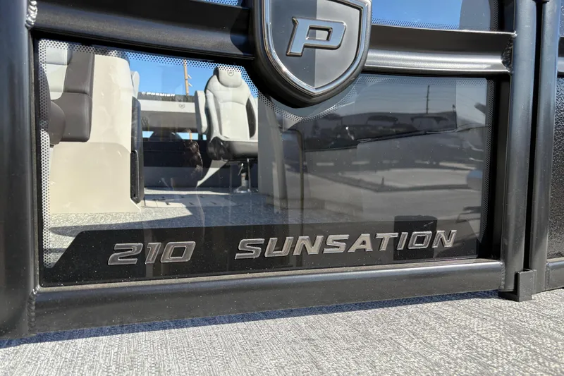 Slide: The Image of 2026 Premier 210 Sunsation RL boat interior with logo and seating. - 6
