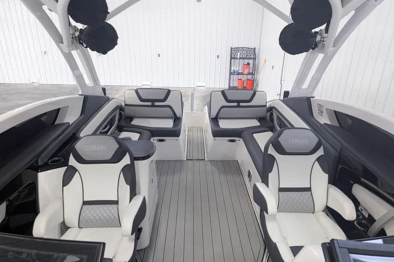 Slide: The Image of 2022 Yamaha Boats 275SD interior with luxurious seating and modern design. - 11