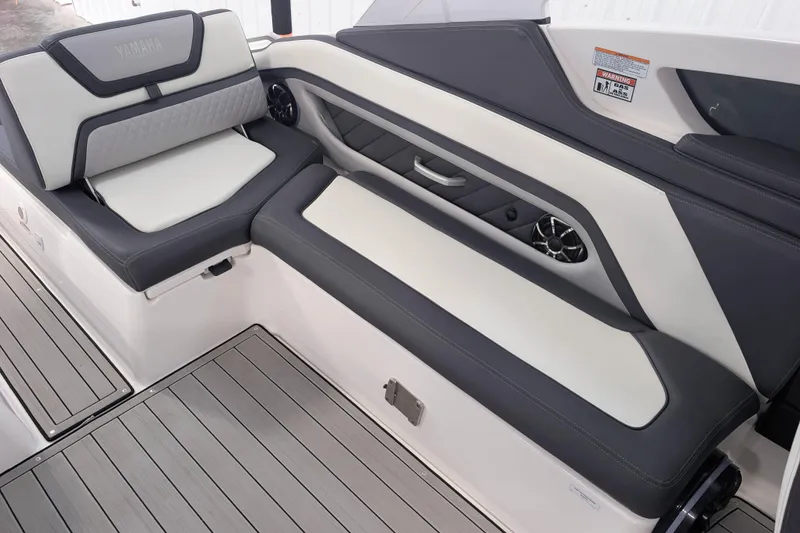 Slide: The Image of 2022 Yamaha Boats 275SD interior seating with sleek design and modern upholstery. - 7