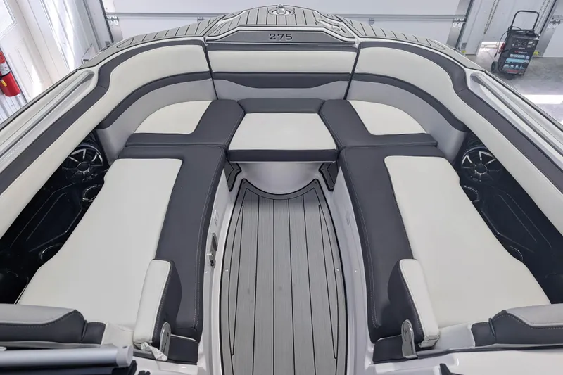 Slide: The Image of Interior of 2022 Yamaha Boats 275SD, featuring sleek seating and modern design. - 9