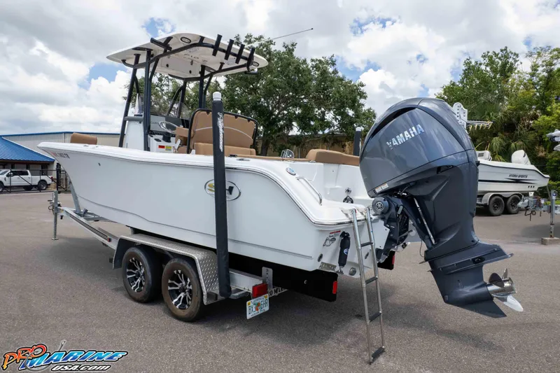 Slide: The Image of 2023 Sea Hunt Ultra 234 boat with Yamaha outboard motor on a trailer. - 10