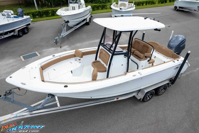 Slide: The Image of 2023 Sea Hunt Ultra 234 boat on trailer, featuring sleek design and spacious seating. - 12