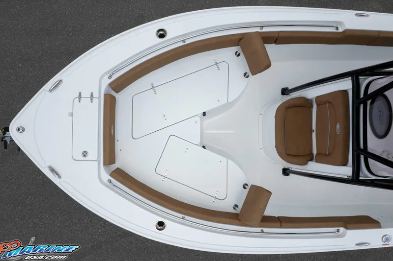 Slide: The Image of 2023 Sea Hunt Ultra 234 boat interior with brown seating and storage compartments. - 16