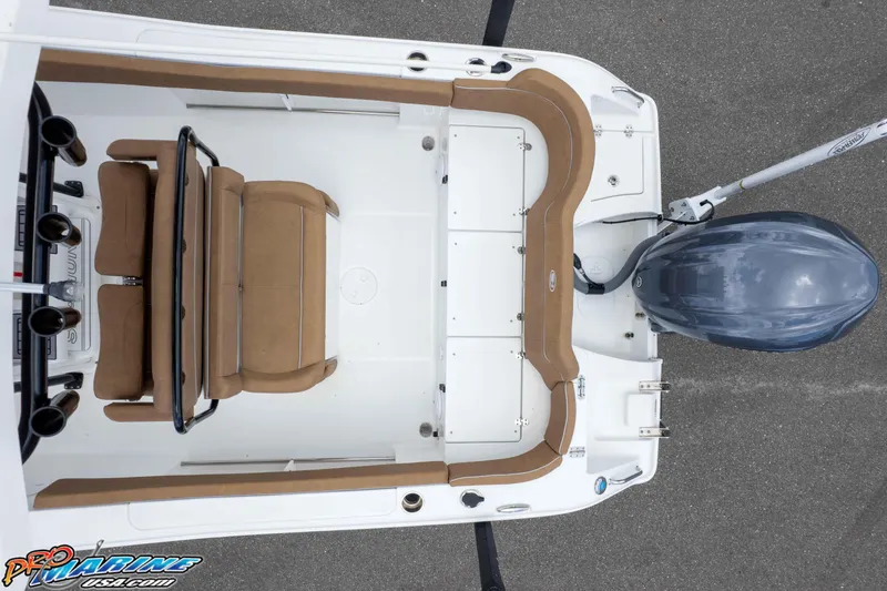 Slide: The Image of 2023 Sea Hunt Ultra 234 boat interior with tan seating and outboard motor, top view. - 17