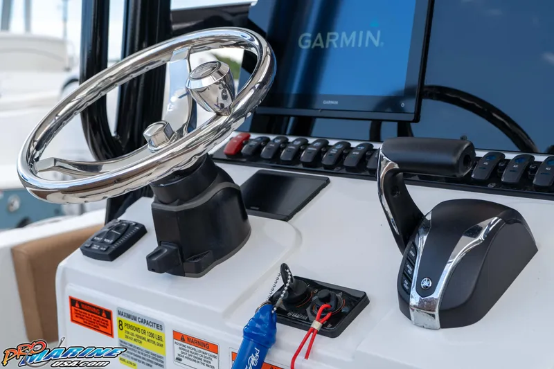 Slide: The Image of 2023 Sea Hunt Ultra 234 helm with Garmin display and controls. - 27