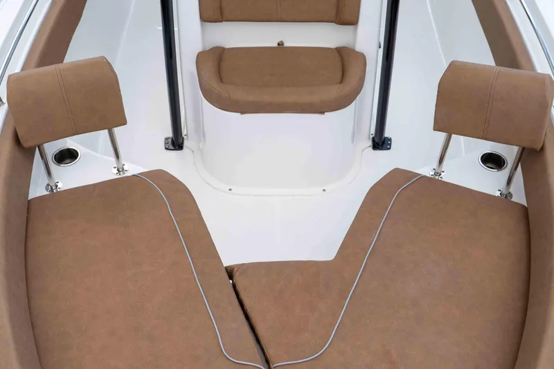 Slide: The Image of 2023 Sea Hunt Ultra 234 boat interior with brown cushioned seating. - 31