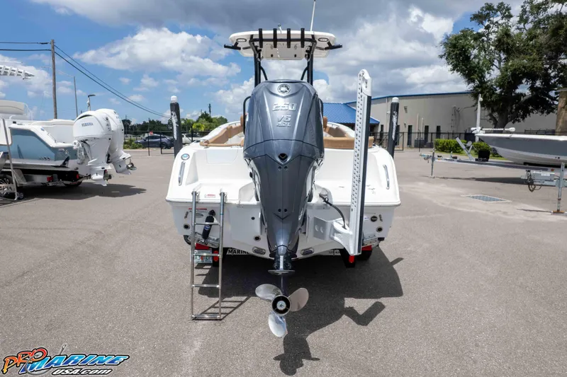 Slide: The Image of 2023 Sea Hunt Ultra 234 boat with Yamaha outboard motor in a marina setting. - 7