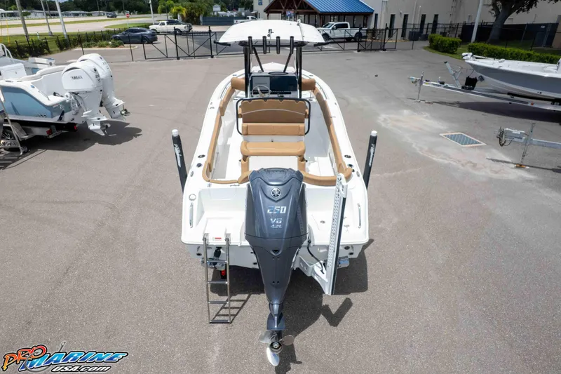 Slide: The Image of 2023 Sea Hunt Ultra 234 boat with Yamaha V6 engine, parked in a marina. - 8