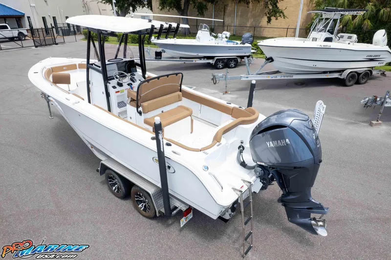 Slide: The Image of 2023 Sea Hunt Ultra 234 boat with Yamaha engine on trailer in parking lot. - 9
