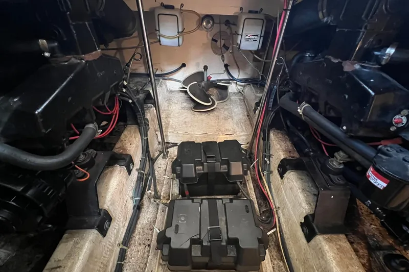 Slide: The Image of Engine room of 1989 Egg Harbor 33 Convertible with visible components and wiring. - 21