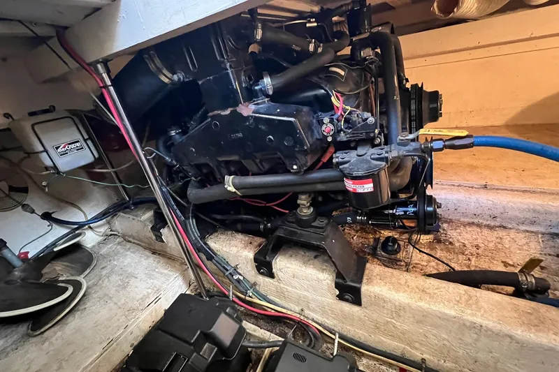 Slide: The Image of Engine compartment of a 1989 Egg Harbor 33 Convertible boat, showcasing mechanical components. - 24