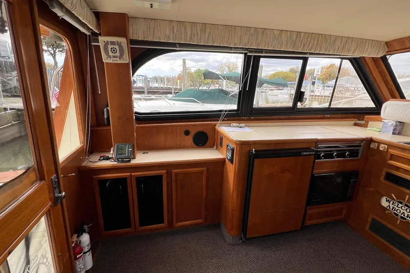 Slide: The Image of Interior of 1989 Egg Harbor 33 Convertible yacht with wooden cabinetry and appliances. - 30