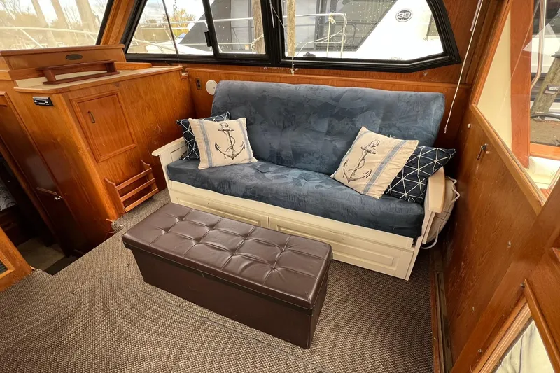 Slide: The Image of Interior of 1989 Egg Harbor 33 Convertible with nautical-themed decor and wooden accents. - 31