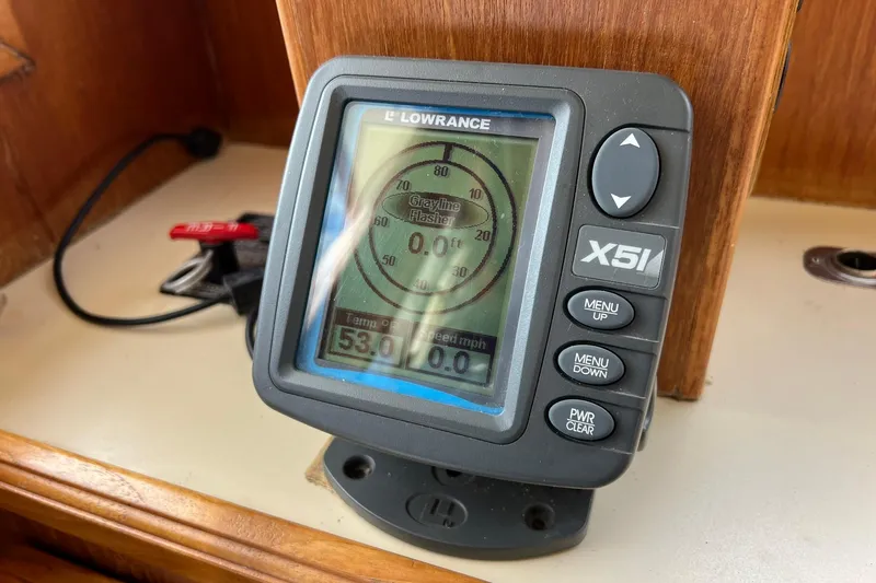 Slide: The Image of Lowrance X51 fishfinder on 1989 Egg Harbor 33 Convertible boat dashboard. - 50