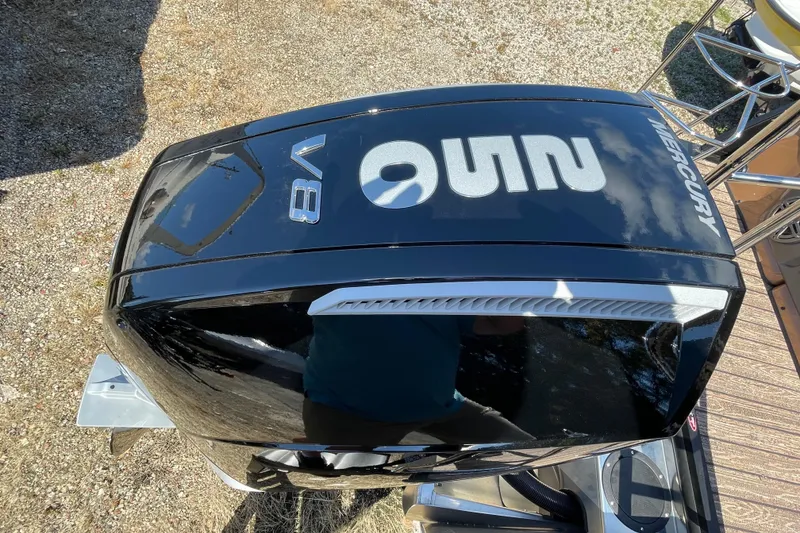 Slide: The Image of Mercury V8 engine on Harris Solstice 250 SLDH, 2026 model, outdoor setting. - 3