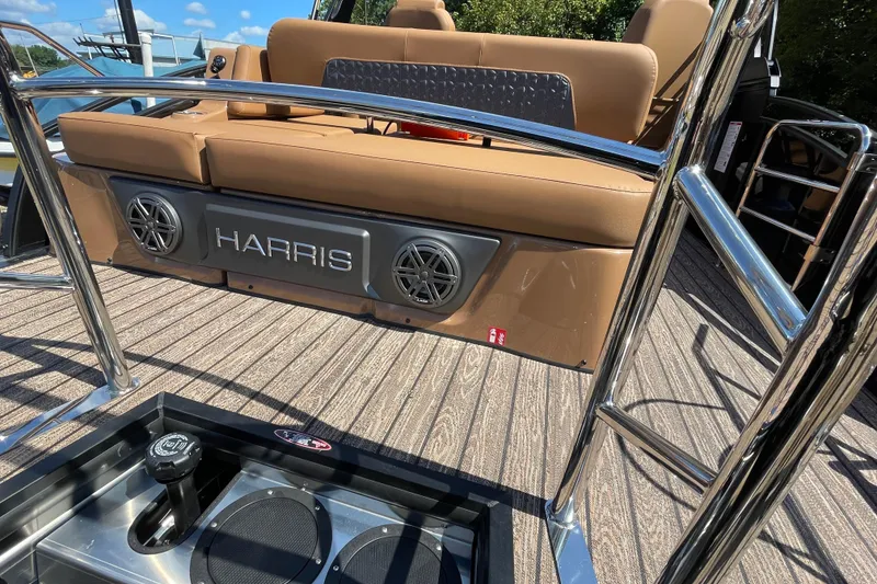 Slide: The Image of 2026 Harris Solstice 250 SLDH boat interior with brown seating and stainless steel accents. - 4