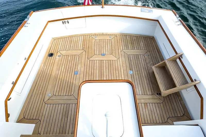 Slide: The Image of 1994 Little Harbor Express boat deck with teak flooring and wooden accents. - 10
