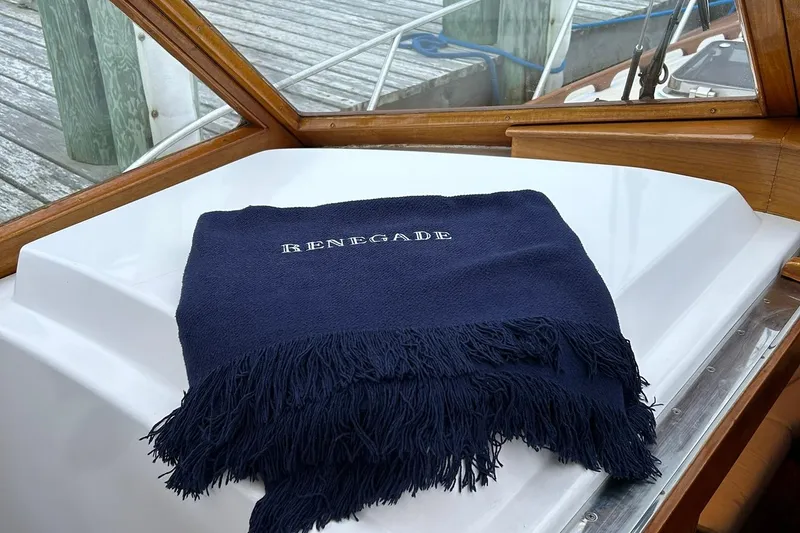 Slide: The Image of Navy blanket with "Renegade" on 1994 Little Harbor Express boat deck. - 12