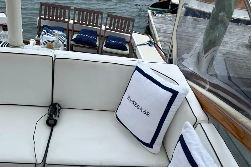 Slide: The Image of Luxurious 1994 Little Harbor Express yacht interior with white seating and nautical decor. - 13